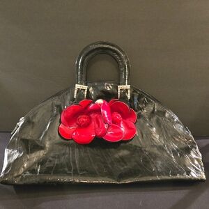 Black Renato Angi Designer Handbag with Red Floral Accent Rainbow Carry Handle